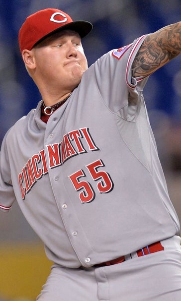 Reds' Latos gets 1st win against hometown Marlins